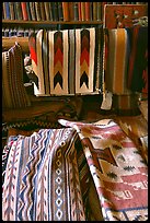 Stacks of varicolored blankets and rugs weaved by Navajo Indians. Hubbell Trading Post National Historical Site, Arizona, USA ( color)