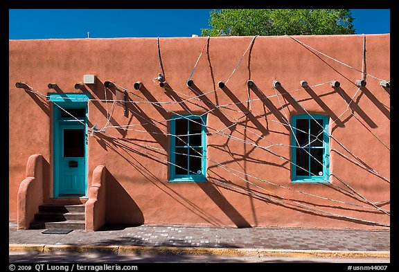 Adobe building tied up with plastic bags. Santa Fe, New Mexico, USA