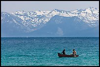 Canoe and snowy mountains, Lake Tahoe, Nevada. USA (color)