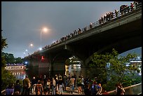 People gathered on Congress Bridge to watch bat fly. Austin, Texas, USA ( color)