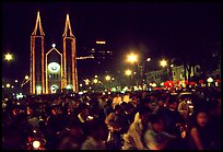 Crowds gather in front of the Cathedral St Joseph for Christmans. Ho Chi Minh City, Vietnam (color)