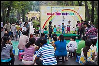 Children singing, Cong Vien Van Hoa Park. Ho Chi Minh City, Vietnam (color)