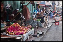 Vendors sleeping on the street at dawn. Ho Chi Minh City, Vietnam (color)
