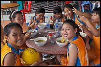 Girls sports team eating, Cong Vien Van Hoa Park. Ho Chi Minh City, Vietnam (color)