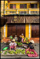 Banana vendors and historic house. Hoi An, Vietnam ( color)