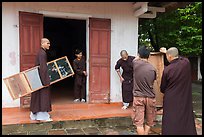 Monks carrying furniture, Thien Mu pagoda. Hue, Vietnam (color)
