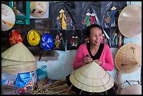 Woman in hat-making workshop. Hue, Vietnam (color)