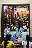 Women worshipping in Phung Son Pagoda, district 11. Ho Chi Minh City, Vietnam (color)