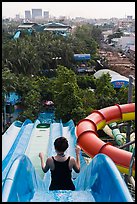 Woman on tall water slide, Dam Sen Water Park, district 11. Ho Chi Minh City, Vietnam (color)