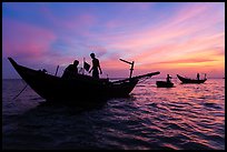 Fishermen on boats at sunset. Mui Ne, Vietnam ( color)