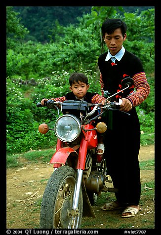 Hmong motorcyclist and boy, Xa Linh. Northwest Vietnam (color)