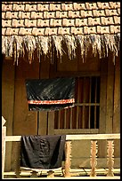 Detail of hut with montagnard dress being dried, between Tuan Giao and Lai Chau. Northwest Vietnam ( color)