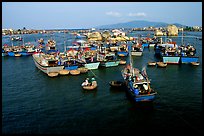 Colorfull fishing boats. Note the circular basket boats used to get to shore.  Nha Trang. Vietnam ( color)