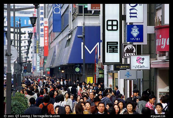 Crowded avenue in the Ginza shopping district. Tokyo, Japan (color)