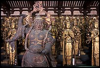Some of the 1001 statues of the thousand-armed Kannon (buddhist goddess of mercy), Sanjusangen-do Temple. Kyoto, Japan