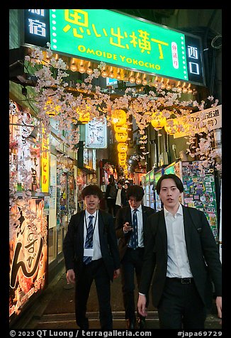 Men in suits at Omoide Yokocho at night, Shinjuku. Tokyo, Japan (color)