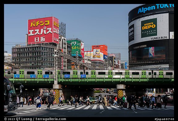Pedestrian crossing and train, Shinjuku. Tokyo, Japan (color)
