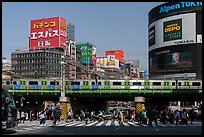 Pedestrian crossing and train, Shinjuku. Tokyo, Japan ( color)