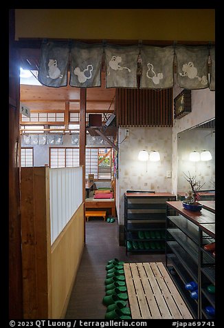 Restaurant entrance with slippers and shoe racks, Fujisawa. Japan (color)