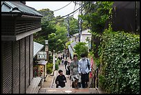 Couple on back street with restaurants. Enoshima Island, Japan ( color)