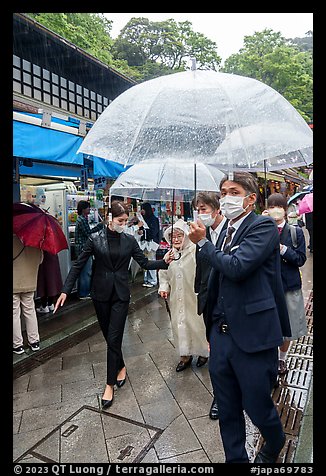 Visitors with umbrellas. Enoshima Island, Japan (color)