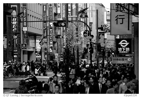 Street in Shinjuku 3-chome looking towards Yotsuya in front of Kinokuniya. Tokyo, Japan (black and white)
