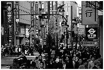 Street in Shinjuku 3-chome looking towards Yotsuya in front of Kinokuniya. Tokyo, Japan ( black and white)