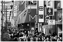 Crowded avenue in the Ginza shopping district. Tokyo, Japan (black and white)