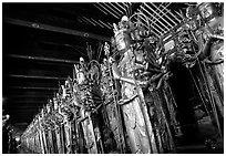 Rows of statues of the thousand-armed Kannon (buddhist goddess of mercy), Sanjusangen-do Temple. Kyoto, Japan ( black and white)