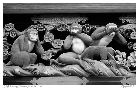 Three-monkey relief carving (hear no evil, see no evil, speak no evil) on Shinkyusha. Nikko, Japan (black and white)