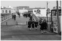 Schoolchildren walk over the Benten Bridge. Fujisawa, Japan ( black and white)