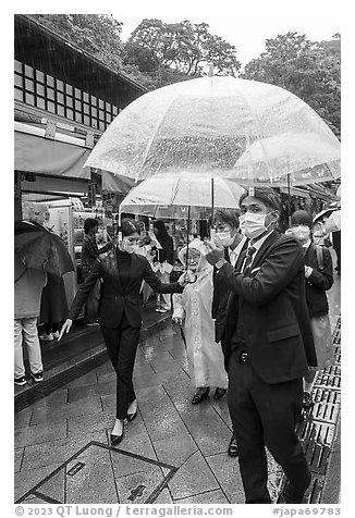 Visitors with umbrellas. Enoshima Island, Japan (black and white)
