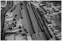 Rail tracks and cargo cars in winter. Calgary, Alberta, Canada (black and white)