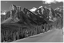 Cyclists on the road to the Valley of Ten Peaks. Banff National Park, Canadian Rockies, Alberta, Canada (black and white)