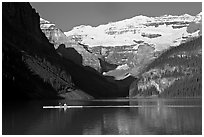 Rower, Lake Louise, and Victoria Peak, early morning. Banff National Park, Canadian Rockies, Alberta, Canada (black and white)