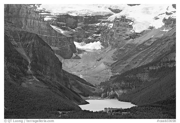 Distant view of Lake Louise and Chateau Lake Louise at the base of Victorial Peak. Banff National Park, Canadian Rockies, Alberta, Canada (black and white)