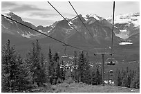 Riding a tram at Lake Louise ski resort. Banff National Park, Canadian Rockies, Alberta, Canada (black and white)