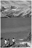 Family standing on the shores of Bow Lake. Banff National Park, Canadian Rockies, Alberta, Canada (black and white)