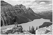 Hiker standing on a rock overlooking Peyto Lake. Banff National Park, Canadian Rockies, Alberta, Canada ( black and white)