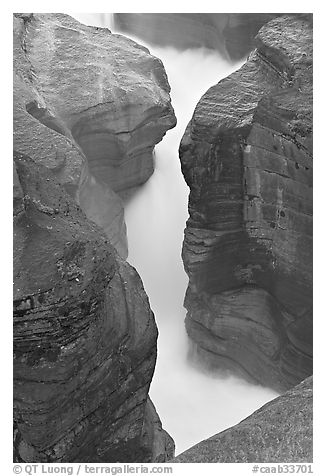 River flowing through narrow slot, Mistaya Canyon. Banff National Park, Canadian Rockies, Alberta, Canada (black and white)