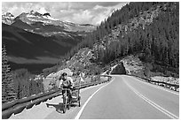 Cyclist with tow, Icefieds Parkway. Jasper National Park, Canadian Rockies, Alberta, Canada ( black and white)