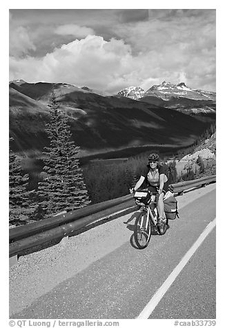 Woman cyclist, Icefieds Parkway. Jasper National Park, Canadian Rockies, Alberta, Canada