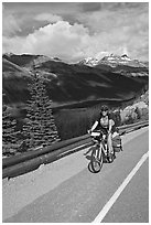 Woman cyclist, Icefieds Parkway. Jasper National Park, Canadian Rockies, Alberta, Canada ( black and white)
