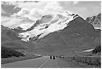 Cyclists on the Icefields Parkway at the base of Mt Athabasca. Jasper National Park, Canadian Rockies, Alberta, Canada ( black and white)