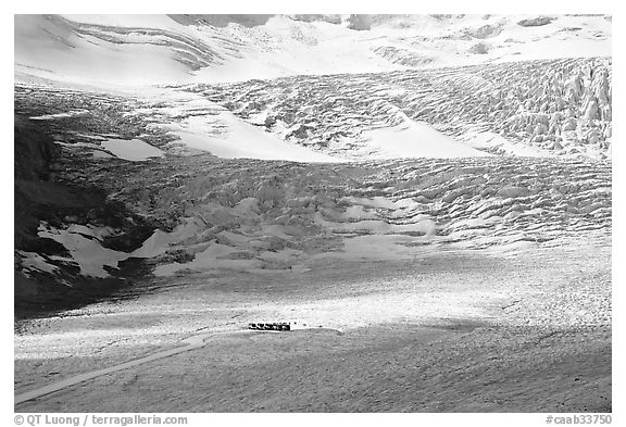 Distant view of snowcoaches parked at the base of the lower icefall on the Athabasca Glacier. Jasper National Park, Canadian Rockies, Alberta, Canada