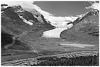 Icefields Center and Athabasca Glacier flowing from Columbia Icefields. Jasper National Park, Canadian Rockies, Alberta, Canada ( black and white)