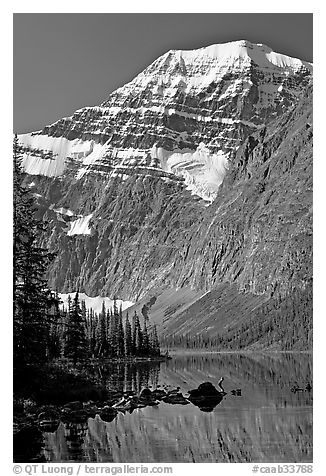 Steep face of Mt Edith Cavell raising above Cavell Lake. Jasper National Park, Canadian Rockies, Alberta, Canada (black and white)