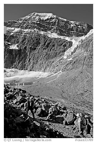 Hikers on trail below the face of Mt Edith Cavell. Jasper National Park, Canadian Rockies, Alberta, Canada (black and white)