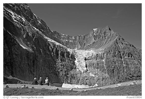 Hikers look at Angel Glacier, late morning. Jasper National Park, Canadian Rockies, Alberta, Canada (black and white)