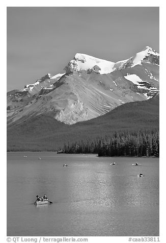 Red canoe on Maligne Lake, afternoon. Jasper National Park, Canadian Rockies, Alberta, Canada (black and white)